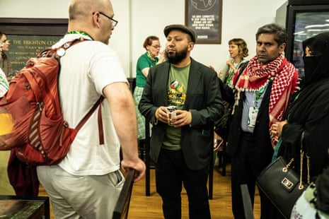 Mothin Ali, the Green party’s co-deputy leader, talking to delegates during a break in the vote on Zionism.