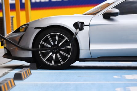 An electric vehicle being charged