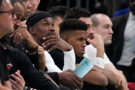 Heat forward Jimmy Butler watches from the bench during the second half of Thursday’s game at TD Garden in Boston.