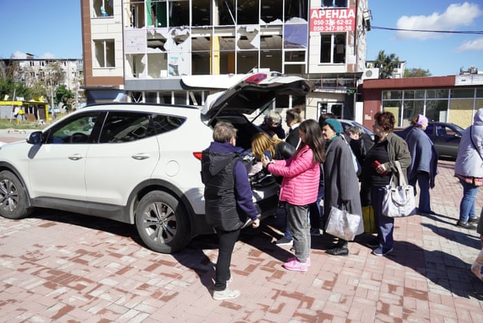 People in Mariupol, which spent months being besieged by Russian forces, cast “votes” in the back of a car on Sunday.