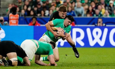 Jordie Barrett of New Zealand tackles Ireland’s Jimmy O’Brien.