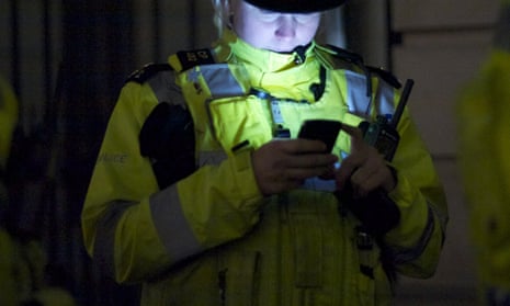 A police officer with a mobile phone