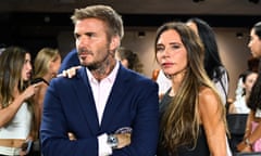 David and Victoria Beckham pose for a photo in casual evening wear