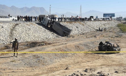 A security official stands guard at the site of a suicide bomb attack targeting a police truck in Quetta in November.