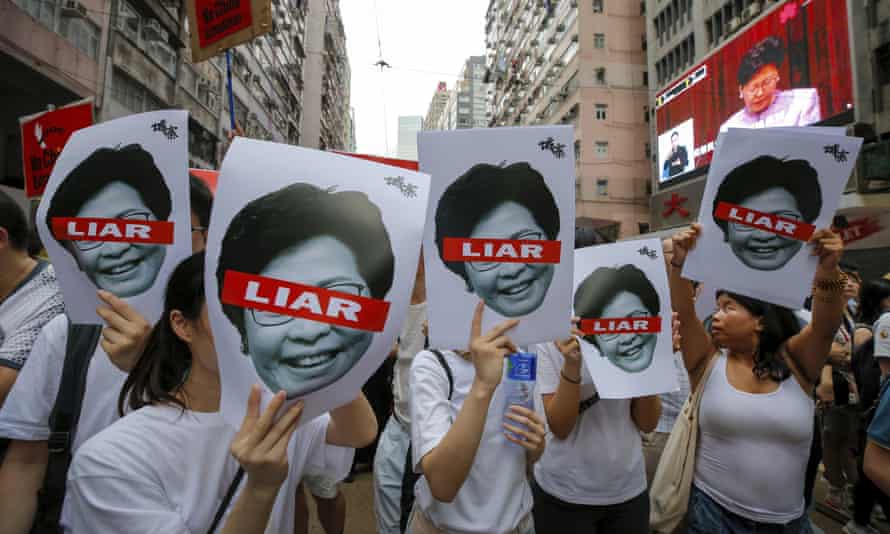 Carrie Lam: a divisive leader in Hong Kong’s turbulent times | Carrie Lam 1 Protesters in 2019 hold pictures of Carrie Lam during a march against the proposed amendments to an extradition law.