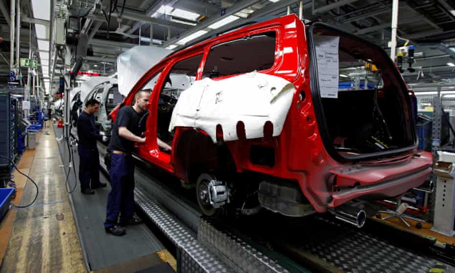 Workers assemble Volvo vehicles at the firm’s Gothenburg factory.