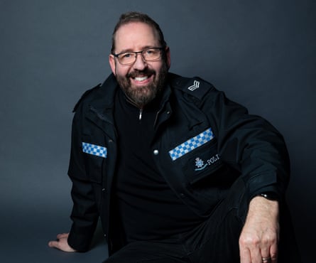 Alfie Moore in police uniform.