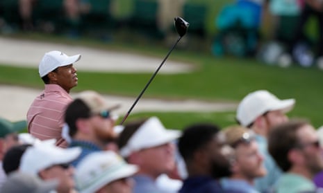 Tiger Woods watches his tee shot on the third hole during his first round round at Augusta.