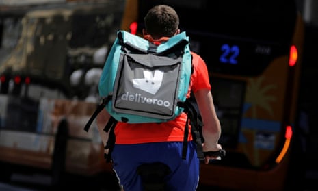 A food delivery cyclist carries a Deliveroo bag in Nice, France