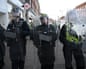 Police in riot gear on Epsom high street during protest over alleged rape incident