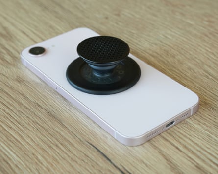 A MagSafe Popsocket on the back of an iPhone 17e.
