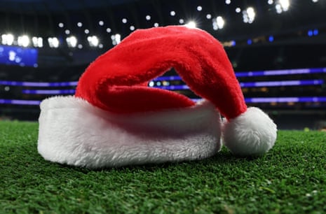 A Father Christmas hat on the pitch at the Tottenham Hotspur Stadium.