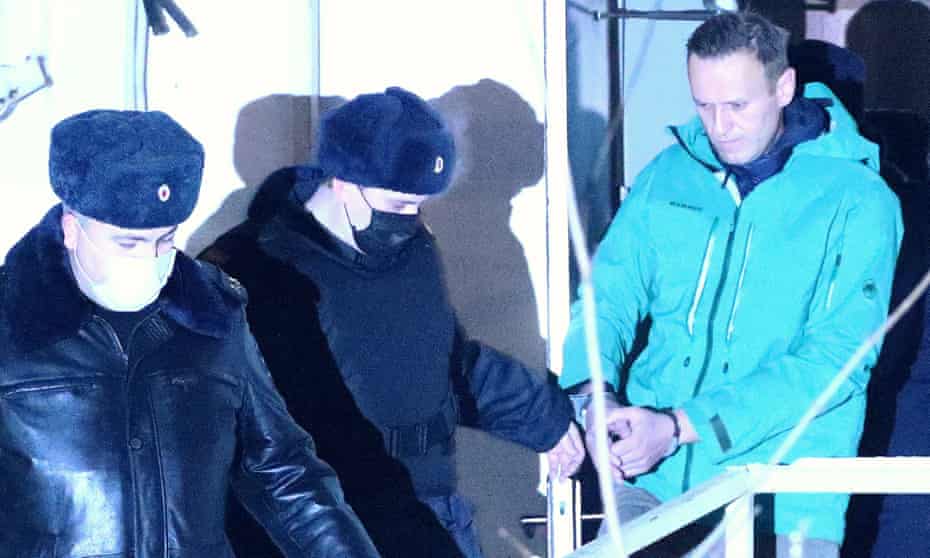 Alexei Navalny is detained on arrival at Sheremetyevo international airport in Moscow on 17 January