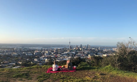 Picnickers on Mt Eden above Auckland enjoying the first day free of social restirctions.