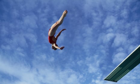 woman diving off diving board