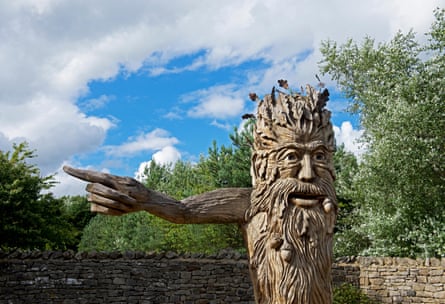 Carving of a green man pointing