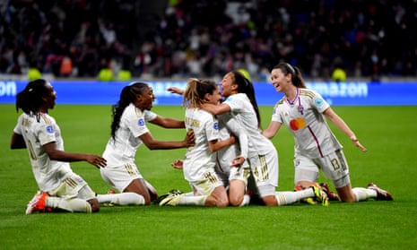 Amel Majri of Olympique Lyonnais celebrates scoring her team's third goal with teammates