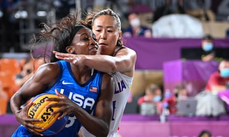 USA player Jacquelyn Young shields the ball from Mongolia’s Solongo Bayasgalan.