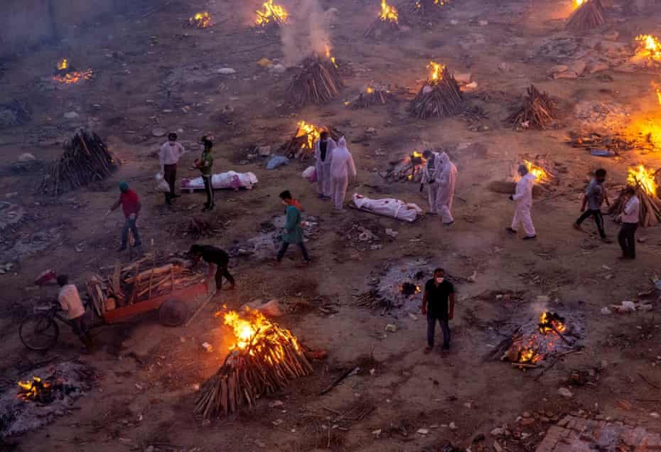 Agency photographer of the year – 2021 shortlist | World news 25 People wait to cremate victims who died due to the coronavirus disease at a crematorium ground in New Delhi, India, 23 April.