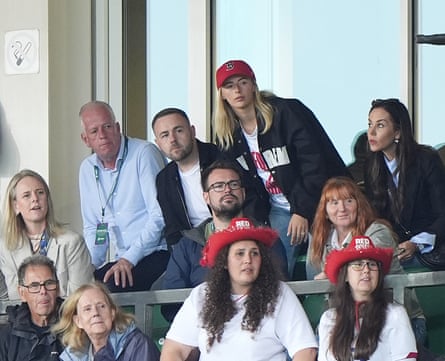Lioness Chloe Kelly (centre right) and her husband Scott Moore watch on in the stands.