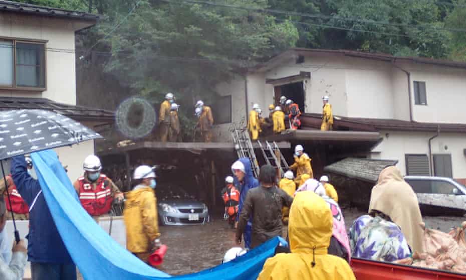 Rescue team members at the site of a mudslide in Okaya City in Nagano on Sunday.