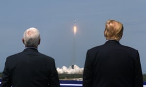 Donald Trump and Vice-President Mike Pence watch the launch of a SpaceX Falcon 9 rocket and Crew Dragon spacecraft at Cape Canaveral, Florida.