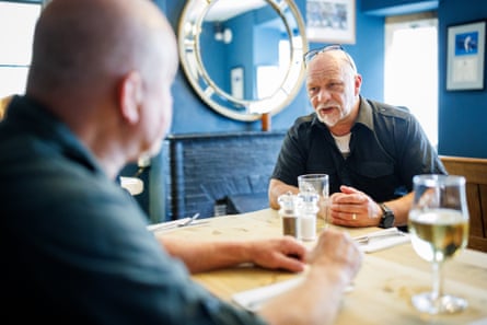 Gavin and Tony chatting at a restaurant table