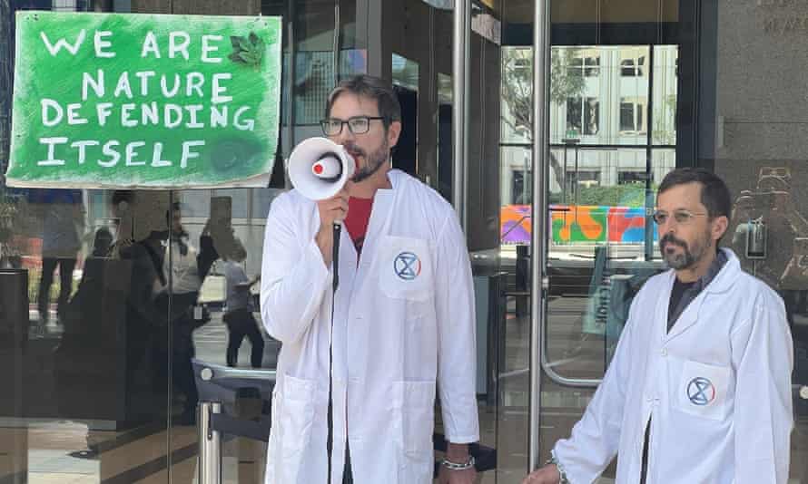 peter kalmus and colleague chained to the jp morgan chase building, los angeles, 6 april this year