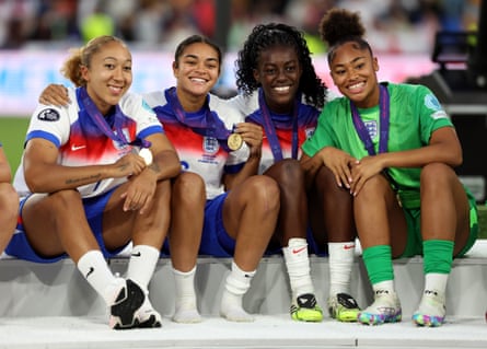 Lauren James, Jess Carter, Michelle Agyemang and Khiara Keating pose with their medals after victory in the Euro 2025 final match between England and Spain