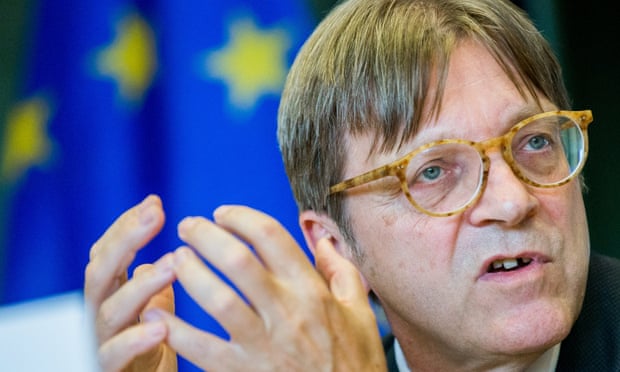 Guy Verhofstadt in front of an EU flag