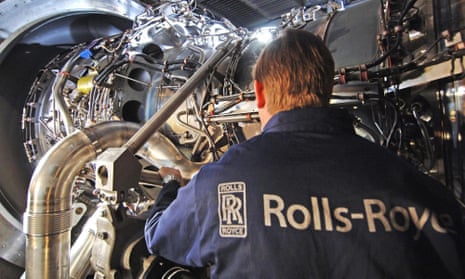 A Rolls-Royce worker with the company's MT30 engine