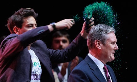 A protester invades the stage and pours glitter on Keir Starmer at the Labour party conference in Liverpool