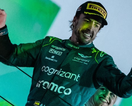 Aston Martin’s Fernando Alonso celebrates his podium finish at the season-opener in Bahrain.