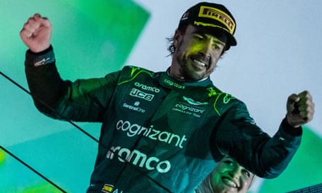 Aston Martin’s Fernando Alonso celebrates his podium finish at the season-opener in Bahrain.