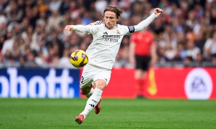 Luka Modric prepares to volley home Real Madrid’s opening goal against Girona.