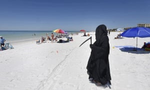 Florida Man Stalks Beach As Grim Reaper To Protest Reopening Amid