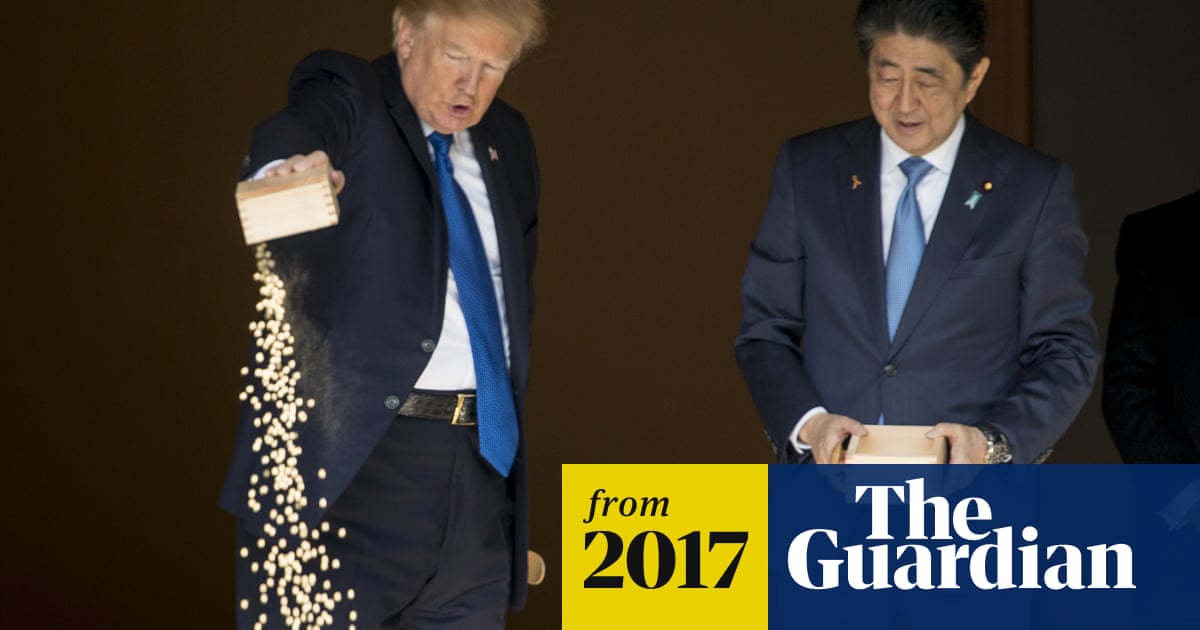 Fishy business: Trump and Abe dump fish food into precious koi pond