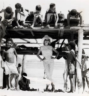Fashion illustration with model wearing cotton capri pants and cropped sleeveless top on location in Papua New Guinea (1961–66).