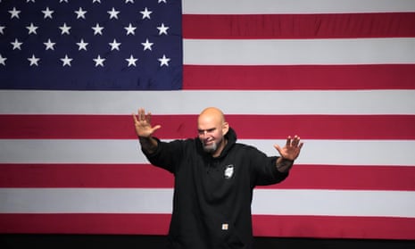 John Fetterman, Democratic candidate for US Senate in Pennsylvania, waves to supporters.