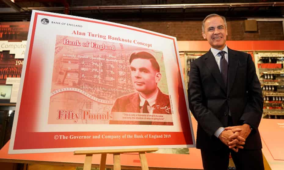 Mark Carney, governor of the Bank of England, with a design for the new £50 note featuring Alan Turing