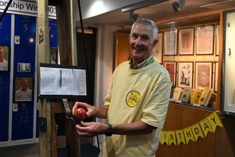 Sussex Museum curator Keith Ridge poses in front of a Catapulta, an early bowling machine created by John Wisden in 1890.