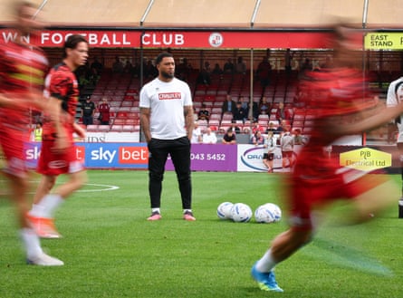 Colin Kazim-Richards watches his team warm up before a game against Cheltenham.