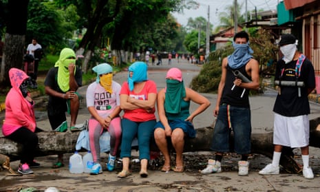 Anti-government demonstrators at an improvised barricade in the town of Masaya