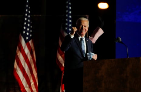 Joe Biden raises a fist as he delivers remarks after early results from the 2020 U.S. presidential election in Wilmington, Delaware.