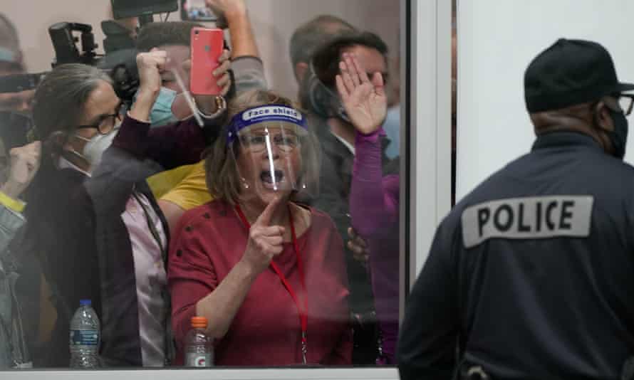 Election challengers yelling at police at the central counting board in Detroit, Michigan, in November.