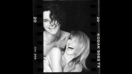 Kylie and Michael Hutchence laugh in a Kodak negative-style photograph.
