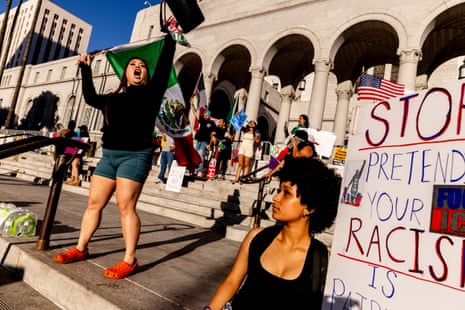 Protesters rally outside City Hall in response to a series of United States Immigration and Customs Enforcement (Ice) raids, in Los Angeles on Sunday.