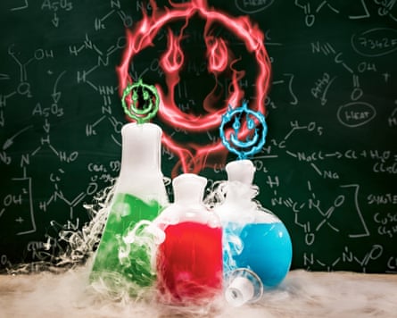 Smoking laboratory flasks with coloured liquids inside