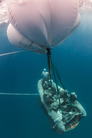 The Raft of Lampedusa being lowered with the aid of air-filled balloons