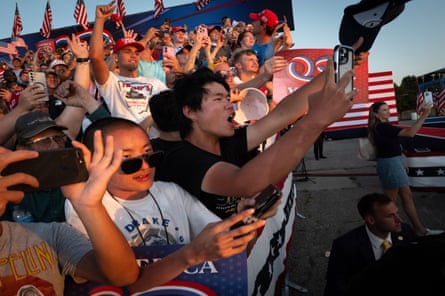 Supporters cheer as Trump leaves after speaking at the rally.
